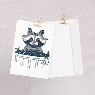 raccoon greeting card with envelope hanging up on display
