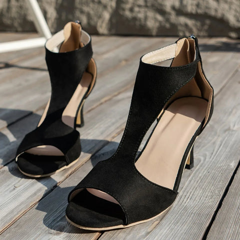 Black suede block heel sandals with open toe and cutout sides