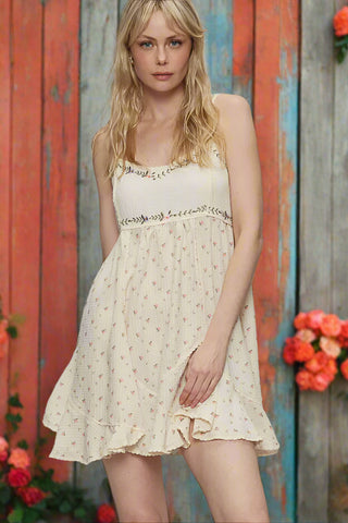 Front pose showing lightweight fabric and floral print on cream dress