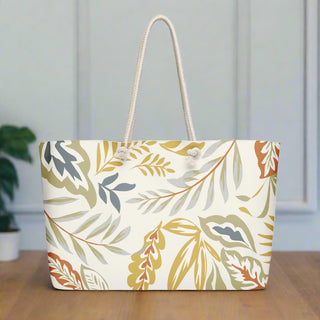 Front view of oversized weekender tote bag with harvest leaf print and rope handles