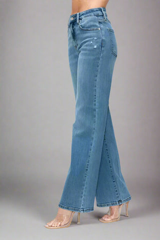 Angled view showing flare leg design on high rise wide leg jeans