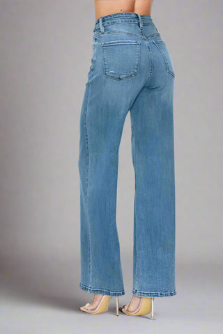Full length view of high rise wide leg jeans in studio lighting