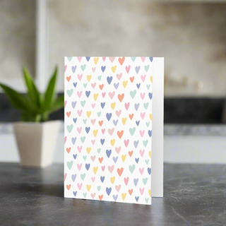 Pastel multicolor hearts greeting card on premium paperboard, blank inside