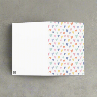 Back view of pastel hearts greeting card showing blank interior for personal message