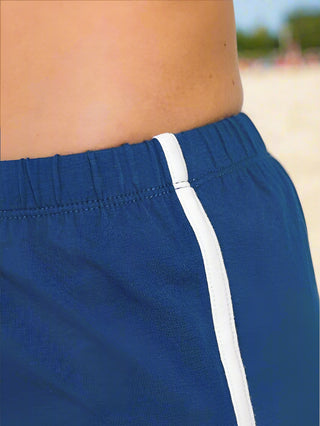 Detail of curved hem and contrast trim on athletic shorts