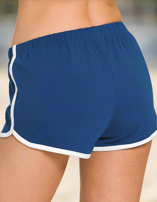 Side view of blue shorts with white piping and elastic waistband