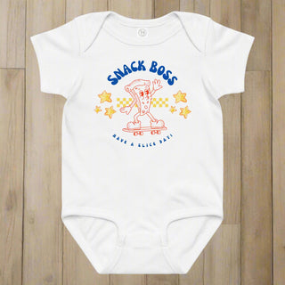 White baby onesie with 'Snack Boss' design on a white background