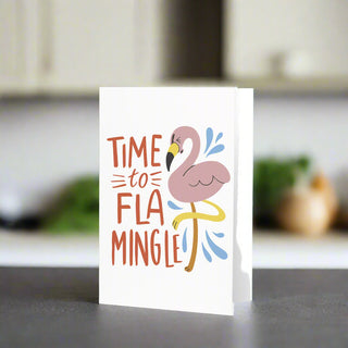 Time to Flamingle greeting card with pink flamingo illustration on modern kitchen counter