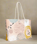 Oversized rope-handle weekender tote styled in indoor setting