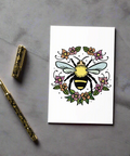Close-up of eco-friendly bee and flowers greeting card showing vibrant toner-based print