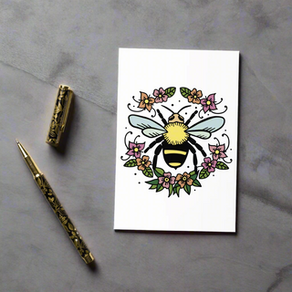 Close-up of eco-friendly bee and flowers greeting card showing vibrant toner-based print