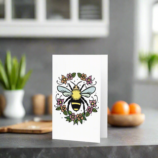  Eco-friendly greeting card featuring a bee inside a floral wreath on premium paperboard