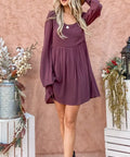 Model walking in styled button-down dress