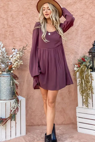 Model walking in styled button-down dress