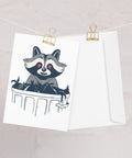 raccoon greeting card with envelope hanging up on display