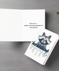 Funny raccoon greeting card open to show message "Here's to us - besties in the same dumpster fire since day one"