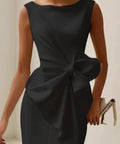 elegant black sleeveless cocktail dress featuring statement bow detail and tailored fit