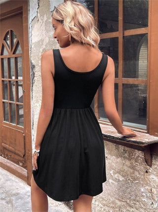 Back view of sleeveless wide strap black mini dress