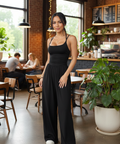 Black spaghetti strap wide leg jumpsuit with a flattering flowing silhouette and relaxed fit.