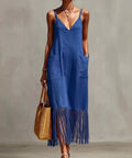 woman wearing blue fringe hem v neck maxi dress with pockets for beach vacation outfit