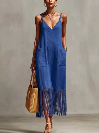 woman wearing blue fringe hem v neck maxi dress with pockets for beach vacation outfit