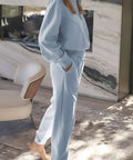Side view of half-zip loungewear set in light blue with relaxed joggers