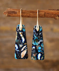 Blue marbled stone earrings with a dangle drop design and elegant gold-plated finish.