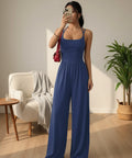 Royal blue wide leg jumpsuit with spaghetti straps and flowing wide leg silhouette.