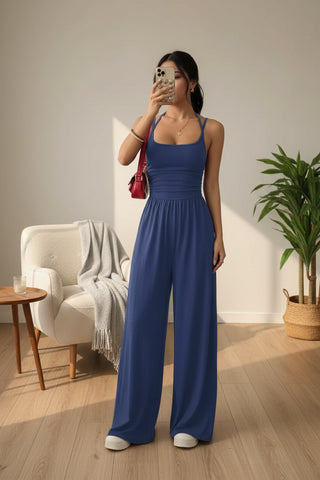 Royal blue wide leg jumpsuit with spaghetti straps and flowing wide leg silhouette.