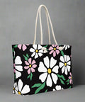 Daisy print oversized canvas tote bag with durable rope handles, shown against neutral background
