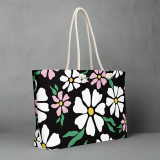 Daisy print oversized canvas tote bag with durable rope handles, shown against neutral background
