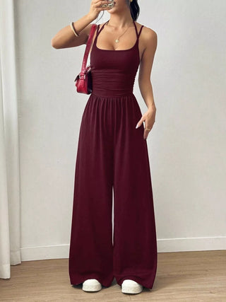 Women's burgundy spaghetti strap wide leg jumpsuit for date nights, winery weekends, and vacations.