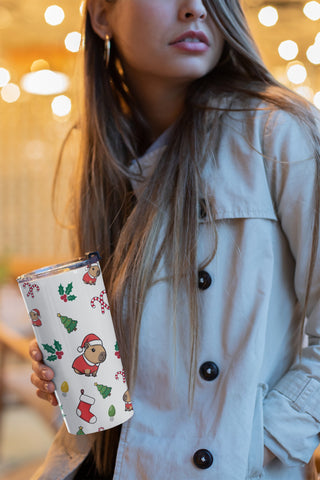 Woman holding Christmas capybara 20oz tumbler 