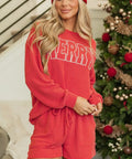 Woman posing in red holiday lounge shorts set