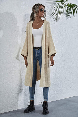 Full-length view of cardigan with casual outfit