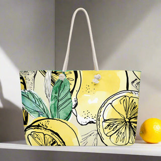 Back view of large yellow tote bag with bold citrus print and braided rope straps