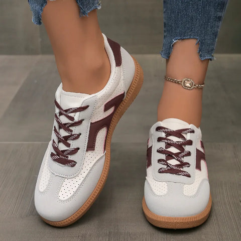 Burgundy and white casual sneakers with retro low top design