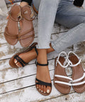 Woman wearing comfort flat sandals styled with casual denim for effortless everyday summer fashion.