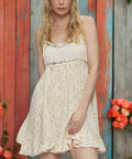Front pose showing lightweight fabric and floral print on cream dress