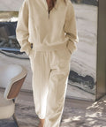 Woman wearing cream half-zip pullover and jogger loungewear set