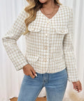 Woman wearing a cream plaid textured button jacket styled with jeans