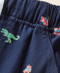 close up of boys dinosaur print cotton shorts with adjustable drawstring waistband