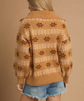 Back view of caramel floral half zip sweater