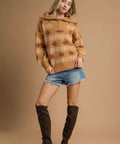 Model posing in half zip fall sweater and tall boots