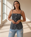 Women's floral button front tank top styled with distressed jeans for casual everyday summer fashion.