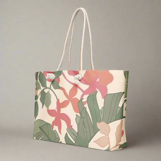 Side angle of large floral travel tote featuring bold pink flower pattern