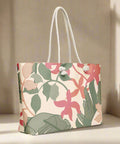 Floral oversized tote in soft lighting on a wood surface with rope handles