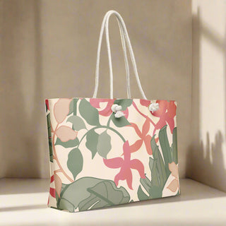 Floral oversized tote in soft lighting on a wood surface with rope handles