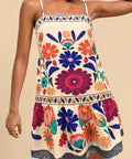 woman wearing colorful floral sleeveless mini dress for summer vacation outfit