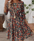 Flowy floral swing dress with ruched bodice and 3/4 sleeves
